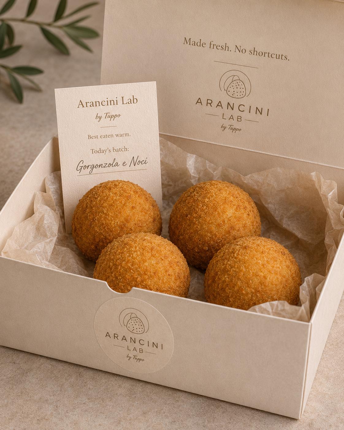 Box of Sicilian arancini by Arancini Lab — gorgonzola e noci batch